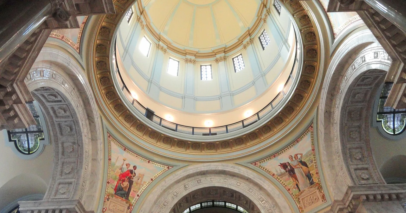The ornate interior dome and rotunda of the Kentucky State Capitol in Frankfort, viewed from the floor below.